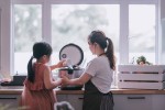 Mother and daughter preparing food in the kitchen with rice cooker (Getty Images/Edwin Tan)