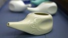 The Centers for Disease Control and Prevention published a report that for the first time connects Acanthamoeba infections to use of Neti pots and other nasal rinsing devices. (AP)