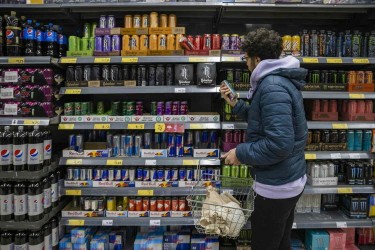 man shopping for energy drinks