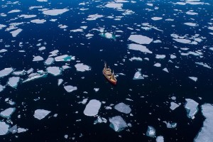 Aerial view of fishing boat in waters of Arctic Ocean, Spitsbergen, Svalbard and Jan Mayen, Norway (Getty Images/Raffi Maghdessian/Aurora Photos)