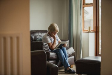 Older woman sitting alone