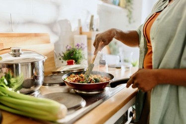 Woman cooking stiry fry