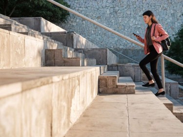 woman walking up stairs