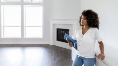 Woman in unfurnished apartment