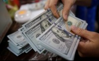 Dollar retreats ahead of minutes from Fed's October meeting