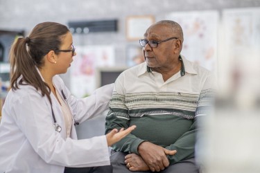 Doctor talking to older man