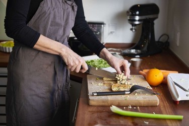 Woman chopping tofu