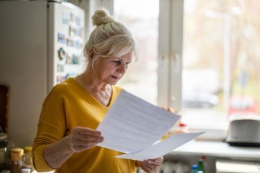 Older woman filling out paperwork