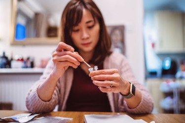 Young woman taking a COVID test