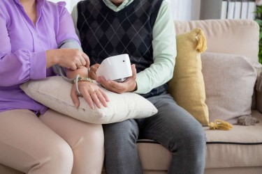 Older couple checking blood pressure