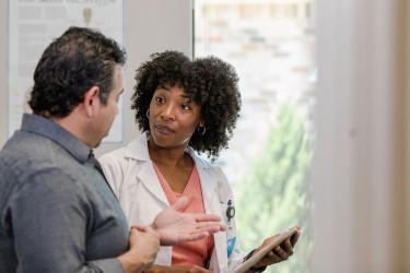 Man talking to doctor