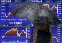 Nikkei ends at 34-year high on tech gains, weaker yen