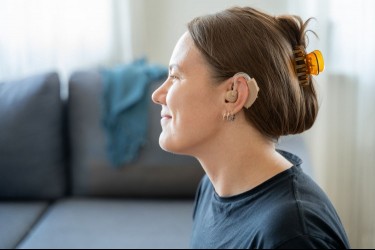 Woman wearing a hearing aid