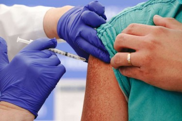 person receives covid-19 vaccine