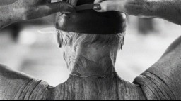 Older female puts on a swim cap