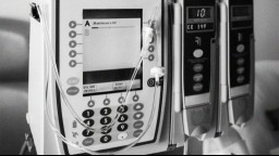 Close up of a medical infusion device which delivers fluids, medications, blood and blood products to patients through IV.