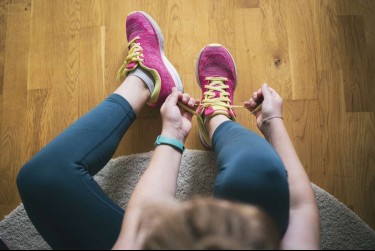 woman tying shoelaces