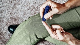 close-up of person taking finger-prick blood sample