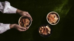 Three bowls of kimchi on a table