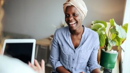 Female cancer patient smiling at the doctor's office 