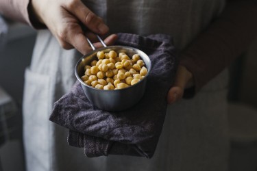 Person holding chickpeas