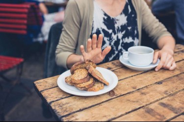 woman saying no to bread