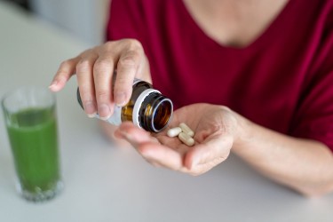 A woman taking supplements