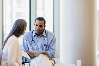 Doctor talking to patient