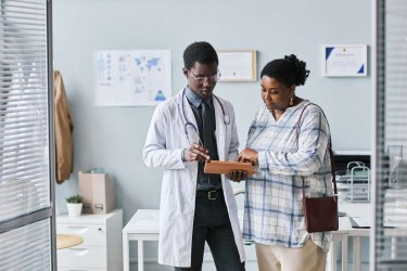 Woman talking to doctor