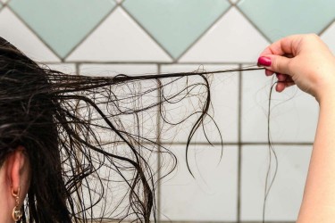 female losing hair in shower