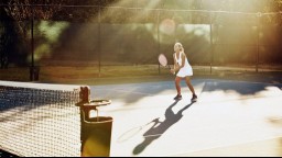 A middle-aged woman plays tennis