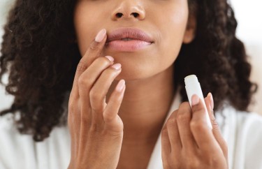 Woman applying chapstick