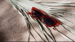 Red sunglasses in the sand